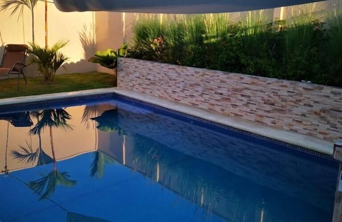 Esterillos Este Casa | Casa perezosa - Piscina comunitaria.