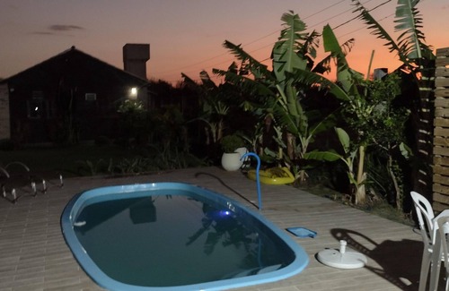Passo de Torres Casa | Sobrado a Beira do rio Manpituba com Piscima Quiosques com Churrasqueira