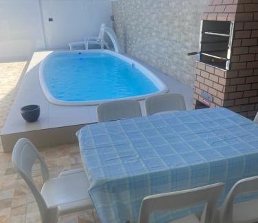Jardim Virginia Casa | Sobrado com piscina e área gourmet na praia da Enseada