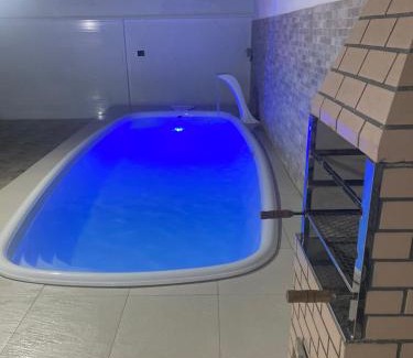 Jardim Virginia Casa | Sobrado com piscina e área gourmet na praia da Enseada