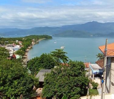 Caiacanga Apartamento | Sossego, Linda vista, praia 400mts e home-office