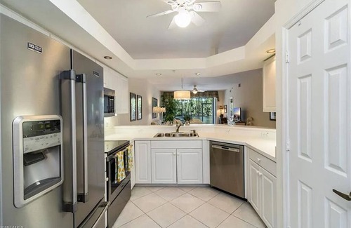 Imperial Golf Estates Condominio | Spacious 3-bedroom first floor coach home with attached garage in North Naples