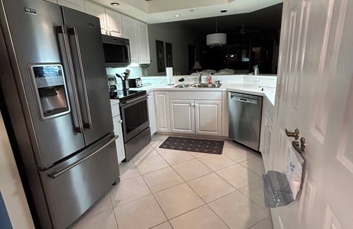 Imperial Golf Estates Condominio | Spacious 3-bedroom first floor coach home with attached garage in North Naples