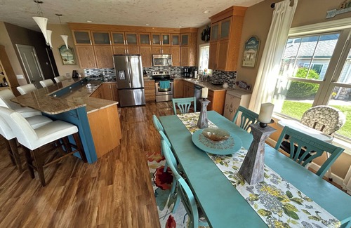 Prudenville Casa | Spacious 4-bedroom lakefront house on Houghton Lake with beach and tiki bar