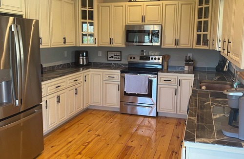 Burkesville Casa | Spacious 4-BR house w/ wraparound porch, fire pit area and hot tub -Sleeps 18-20