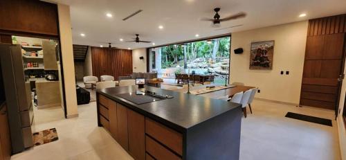 Playacar Villa | Spacious and luxurious villa with 4 bedrooms, swimming pool, tennis court, and beach within walking distance