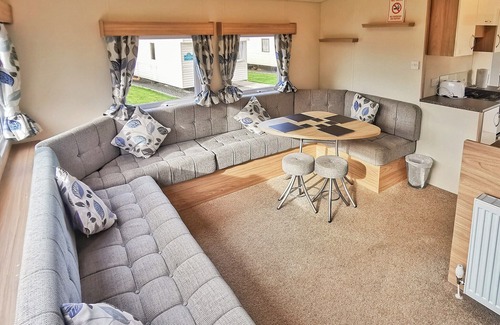 Llanllwchaiarn Casa | Spacious and well presented, 12-ft wide caravan with one double and one twin bedroom.