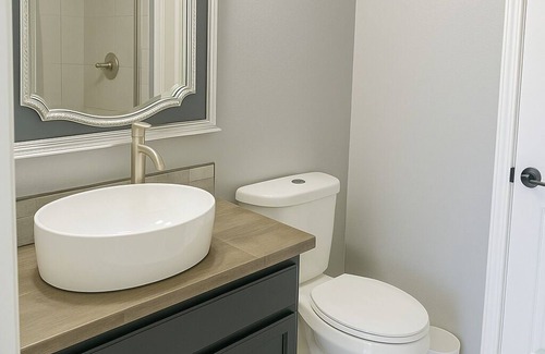 Braithwaite Casa | Spacious comfortable King room. Work-friendly. High-speed internet w/ 50" TVs
