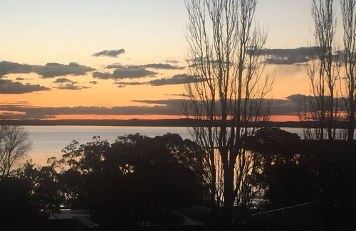 Soldiers Point Casa | Spacious covered balcony overlooking Sunset beach. Large garden and water views