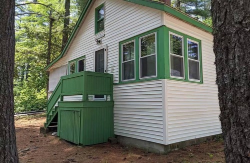 Raymond Cabaña | Spacious, Rustic Retreat with a Large Screened Porch and Water Access