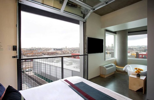 River North Art District Hotel | Spacious Suite with Stunning Market Views, Chic Decor, and Modern Amenities