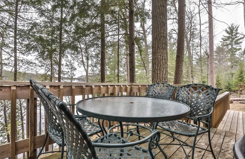 Three Lakes Casa | Splendid lakefront home with deck, private W/D, fireplace, and patio area