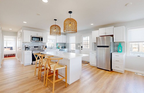 Prime Hook Beach Casa | Sprawling beachfront home with alfresco dining, grill, games, W/D, & open layout