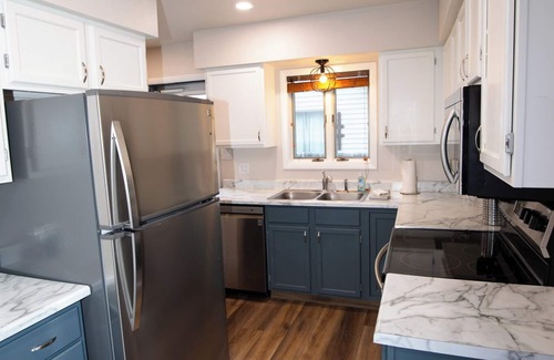 Cody Casa | Stampede Place- New listing! Dog friendly home close to grocery stores and library