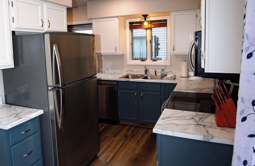 Cody Casa | Stampede Place- New listing! Dog friendly home close to grocery stores and library