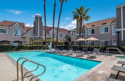 Downtown Village Casa | Stay Near Huntington Beach Pier! w/ Outdoor Pool, Private Parking & Pets Allowed