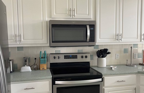 East End Casa | STAY SALTY~ Pool, Gorgeous Bay Views, In Town Center & Golf Cart Friendly Area.