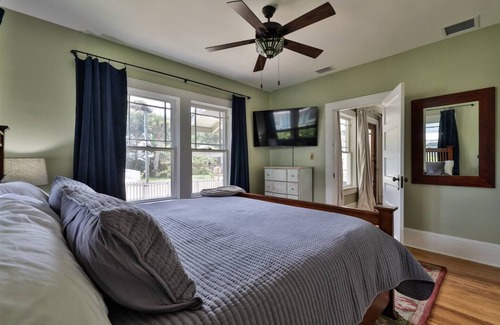 Historic District Casa | Storybook home with wrap around porch and deck