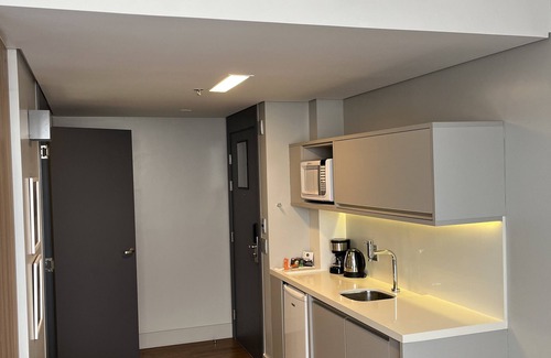 Batel Apartamento | Studio Helbor Stay Batel - Aconchegante com Localização Premium