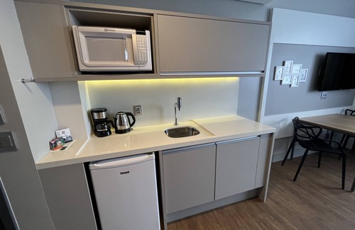 Batel Apartamento | Studio Helbor Stay Batel - Aconchegante com Localização Premium