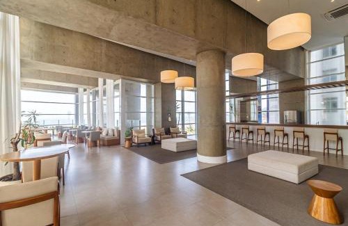 Pompeia Apartamento | Studio moderno em condomínio de luxo pé na areia