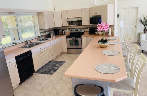 Palm Coast Casa | Stunning Lake house,heated pool, pet friendly,close to beach, restaurants ,bars