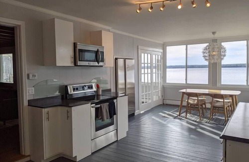 Dedham Cabaña | Stunning lakefront home with 270° water views and private beach near Acadia