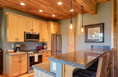 Coeur d'Alene Casa | Stunning mountain escape with lake views, expansive furnished deck & firepit - dog-friendly