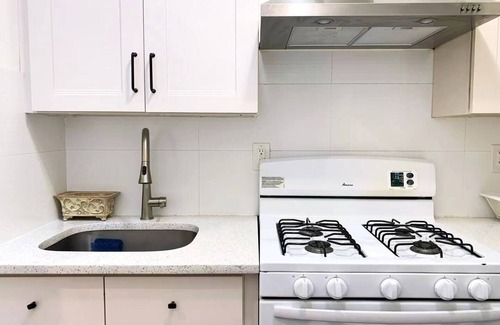 East Flushing Casa | Stylish 3-bedroom House with Skylight and Access to Rooftop Deck and Patio