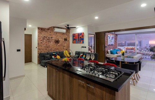 Fluvial Vallarta Apartamento | Stylish Golden Beach View Apartment at Zoho Skies