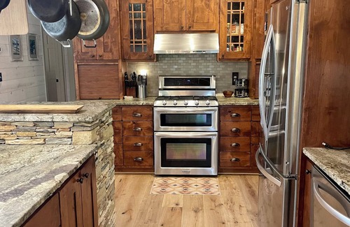 Cullowhee Casa | Stylish lakefront home with large flat yard, boat dock, hot tub & mountain view!
