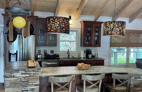 Cullowhee Casa | Stylish lakefront home with large flat yard, boat dock, hot tub & mountain view!