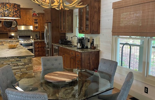 Cullowhee Casa | Stylish lakefront home with large flat yard, boat dock, hot tub & mountain view!
