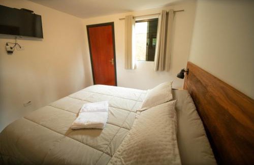 Recanto Araucaria Casa | Suíte jasmim rosa