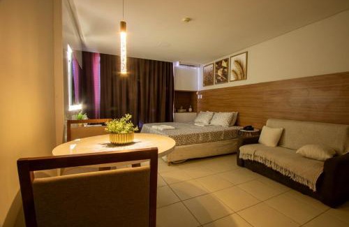 Caminho das Arvores Apartamento | Suíte luxo com tela de cinema no América Towers Studio Residence