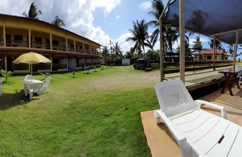 Canavieiras Apartamento | Suite on the seafront with air conditioning and crystal-clear swimming pool.