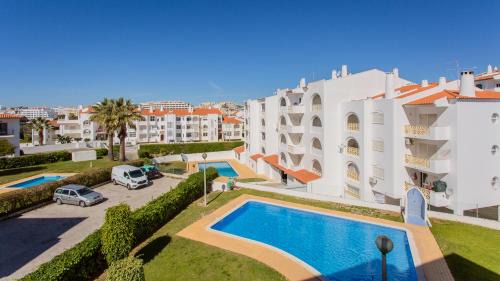 Areias de Sao Joao Apartamento | Sun-kissed Oasis W/Pool by LovelyStay