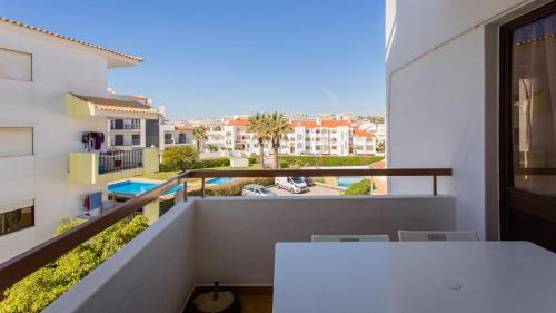 Areias de Sao Joao Apartamento | Sun-kissed Oasis W/Pool by LovelyStay