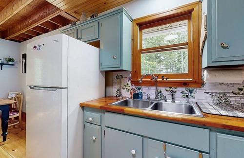 Warren Casa | Sunny, lakefront home on South Pond with private dock, great deck & firepit