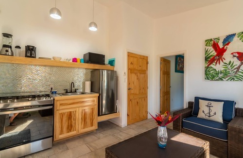 Sandy Bay Hotel | Sunset View Condo @ The Blue Bahia Resort in Sandy Bay