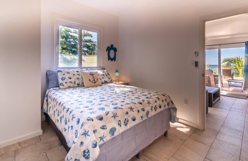 Sandy Bay Hotel | Sunset View Condo @ The Blue Bahia Resort in Sandy Bay