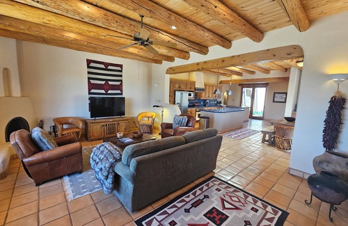 Arroyo Seco Casa | Sweeping panoramic mountain views, expansive adobe privacy wall system