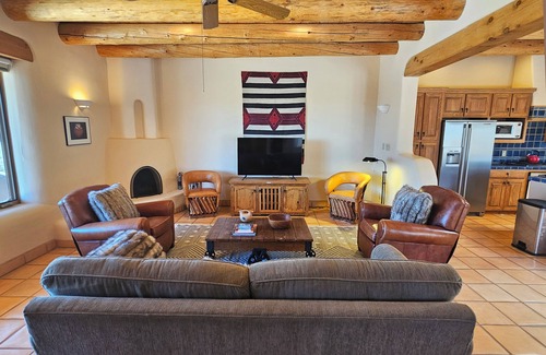 Arroyo Seco Casa | Sweeping panoramic mountain views, expansive adobe privacy wall system