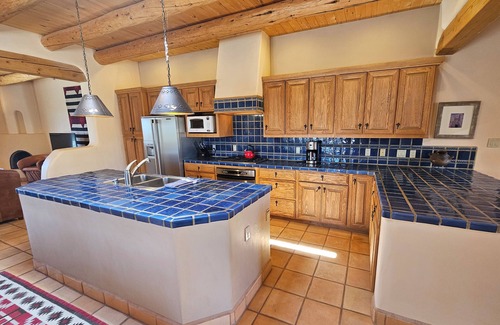 Arroyo Seco Casa | Sweeping panoramic mountain views, expansive adobe privacy wall system
