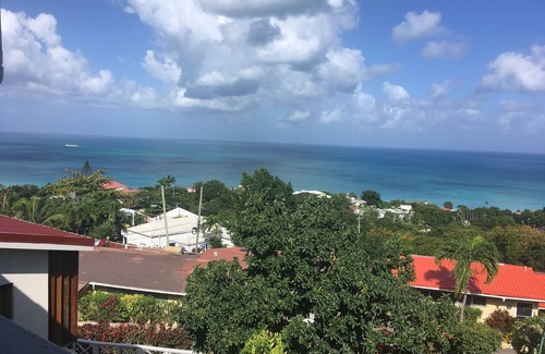 Dickenson Bay Apartamento | Swimming Pool- Balcony/Veranda- Sea & Sunset Views