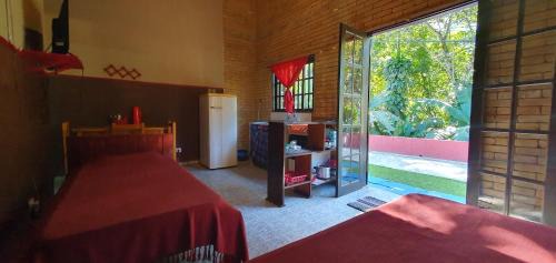 Prumirim Casa | Tahoma Chale Rustico côr Café e vermelho Prumirim Paraiso