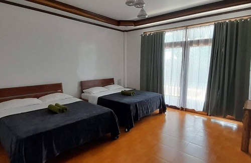 Catangnan Complejo | Takbo Beach Resort - Cabana 2- Two Queen Size Beds with amenities