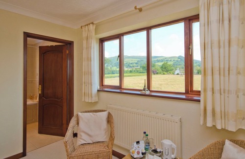 Llandyrnog Cabaña | TALL TREES, pet friendly, character holiday cottage in Llandyrnog