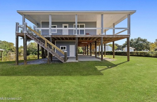 Ocean Springs Cabaña | The Fin & Feather. A Gorgeous Seaside Cottage.2 docks. An incredible experience!