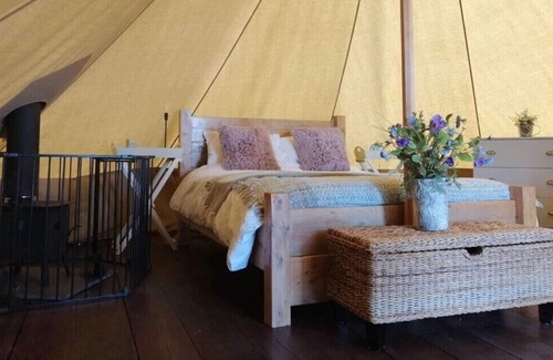 Camborne Cabina | The Glade. Luxury Bell Tent with partial sea and countryside views. Dog friendly